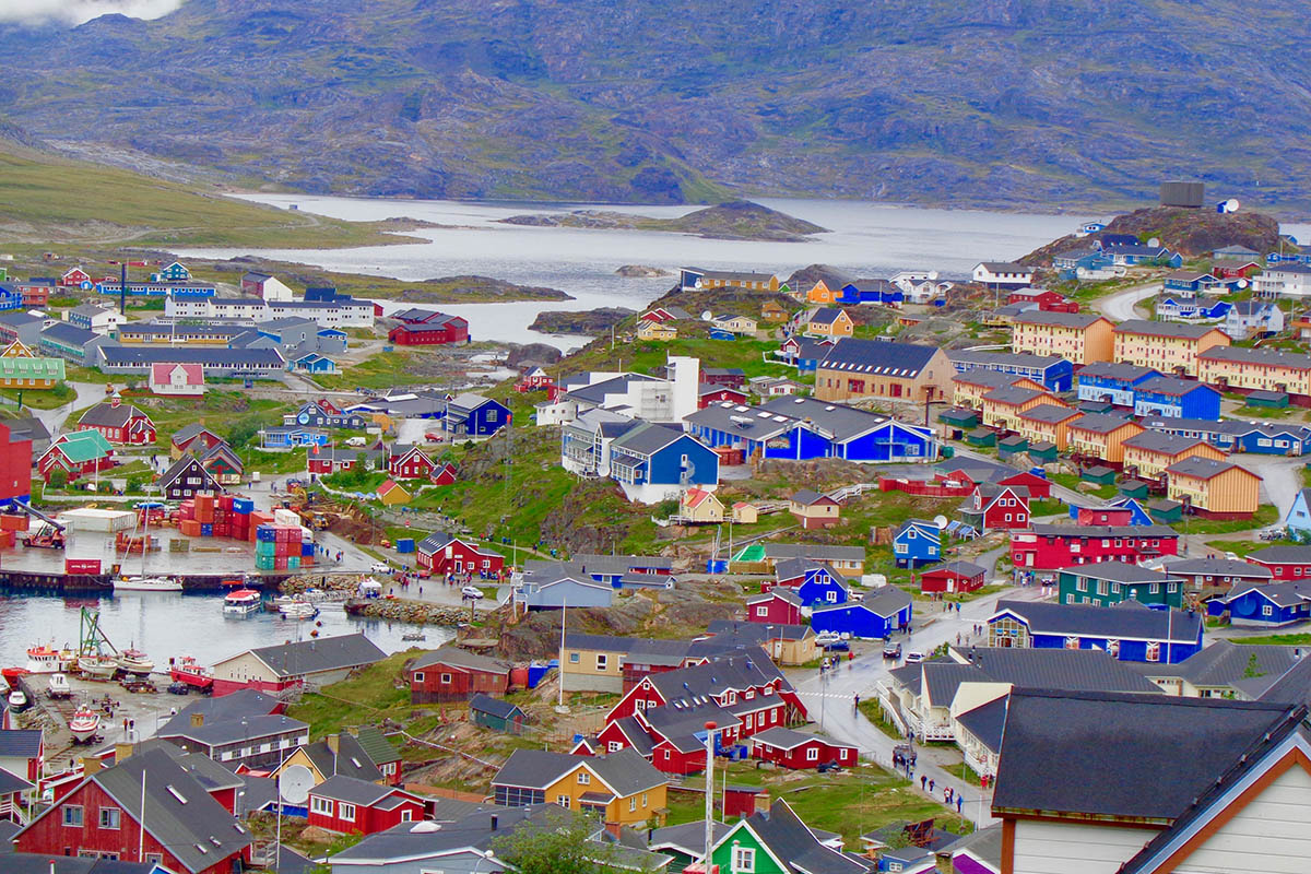 Colourful houses and stunning backdrop of Qaqortoq, explore Greenland