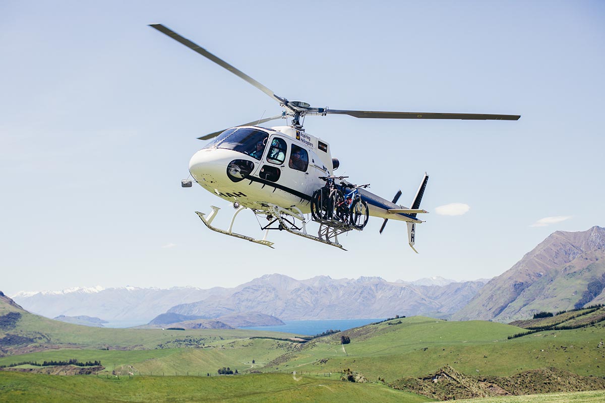 Helicopter taking off at Mahu Whenua Lodge in New Zealand's South Island