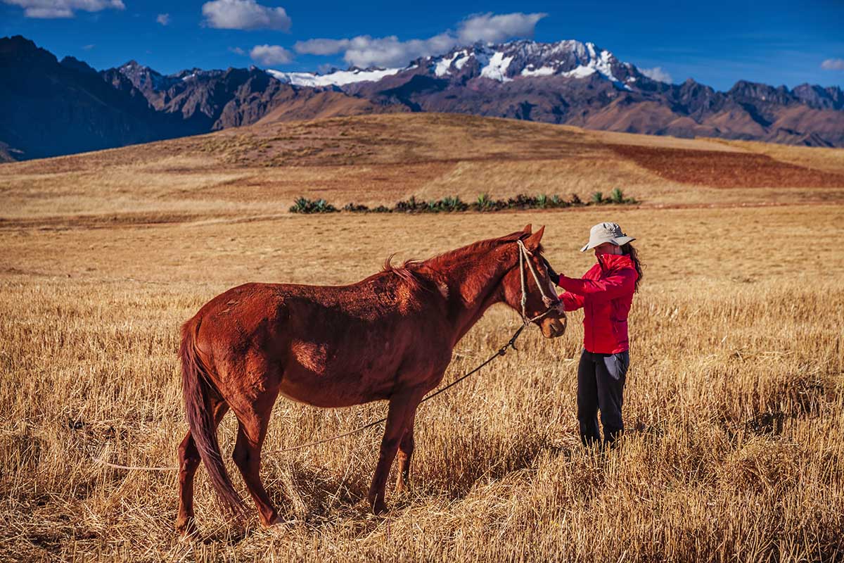 Horse riding in the Sacred Valley with the Andes Mountains as the perfect backdrop