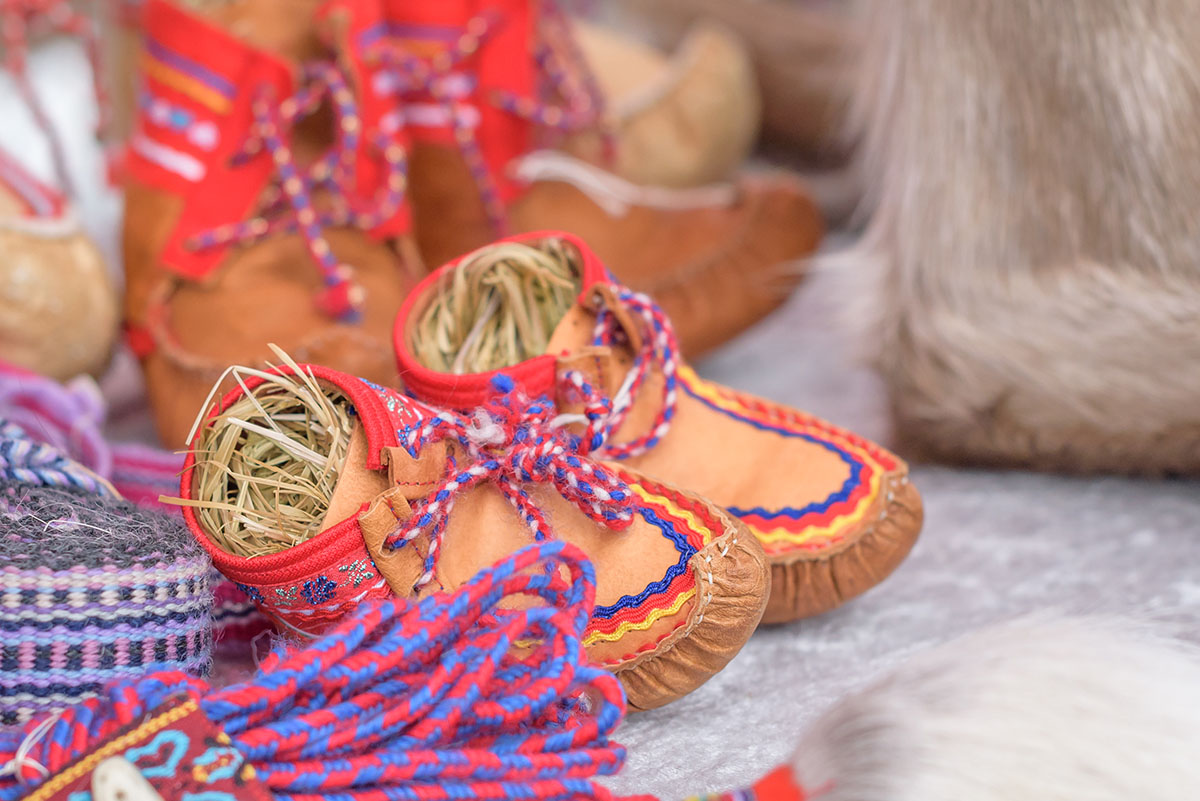Traditional sami handmade leather footwear for children made from reindeer hide