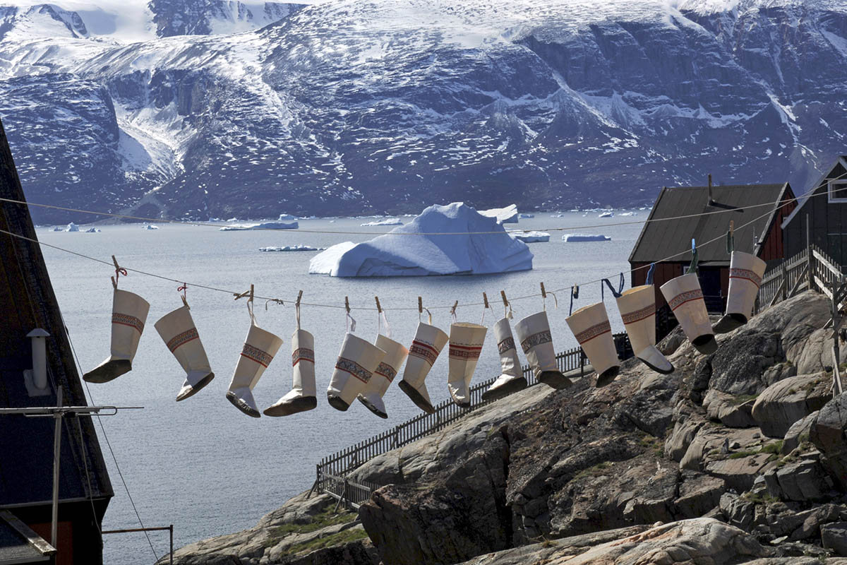 Discover Greenland: Traditional sealskin boots have been hung out to dry on a washing line in Uummannaq in western Greenland