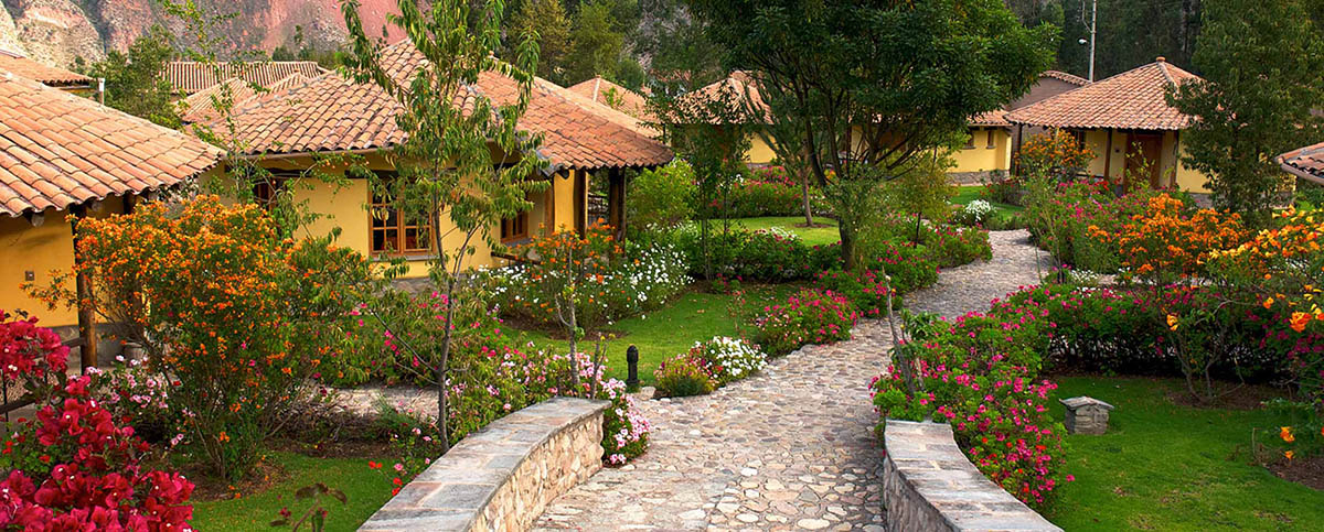 Casitas dotted around mature gardens at the Sol Y Luna Hotel, in Peru's Sacred Valley