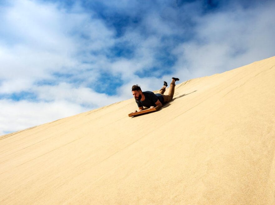 Sandboarding near Shipwreck Lodge