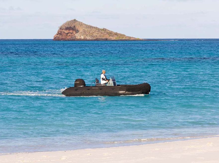 A panga coming to shore from the Aqua Mare, The Galapagos
