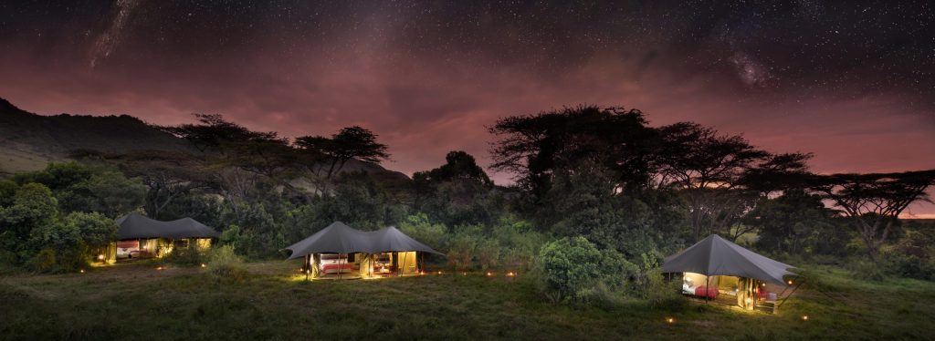 Exterior shot at dusk of ANGAMA SAFARI CAMP