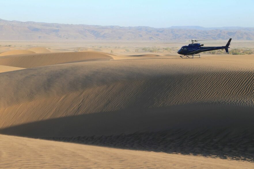 Explore by helicopter from Kalepo Camp