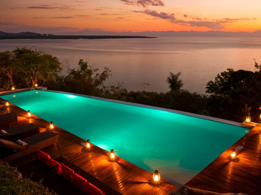 Pool at dusk at Pumulani Lodge, Lake Malawi, Malawi