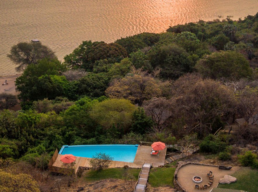Pool at dusk at Pumulani Lodge, Lake Malawi, Malawi