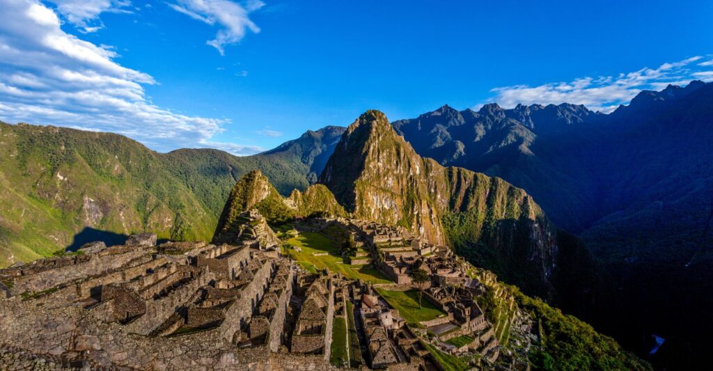 Machu Picchu ancient Inca citadel set high in the Andes of Peru, surrounded by green mountain peaks.