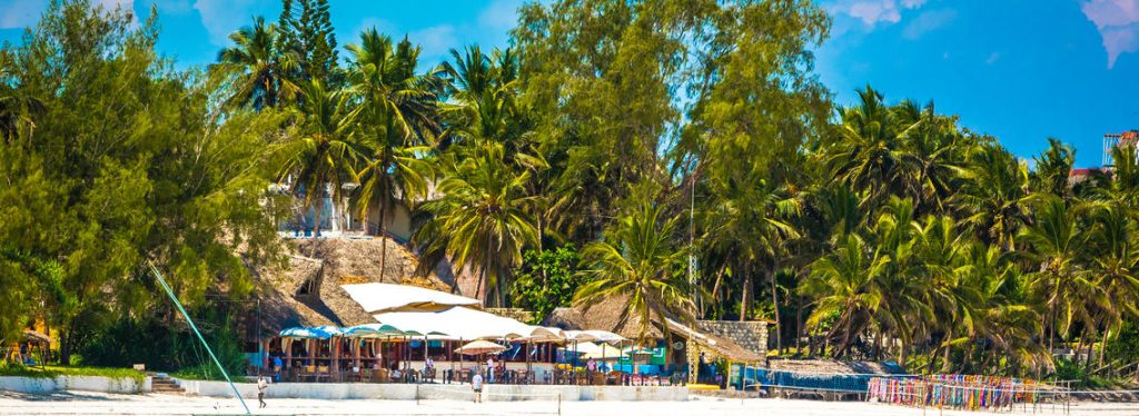 Exterior of Sands at Nomad, Diani Beach, people and bar in Kenya